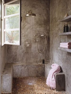 Baño con ducha de obra y  con paredes de microcemento